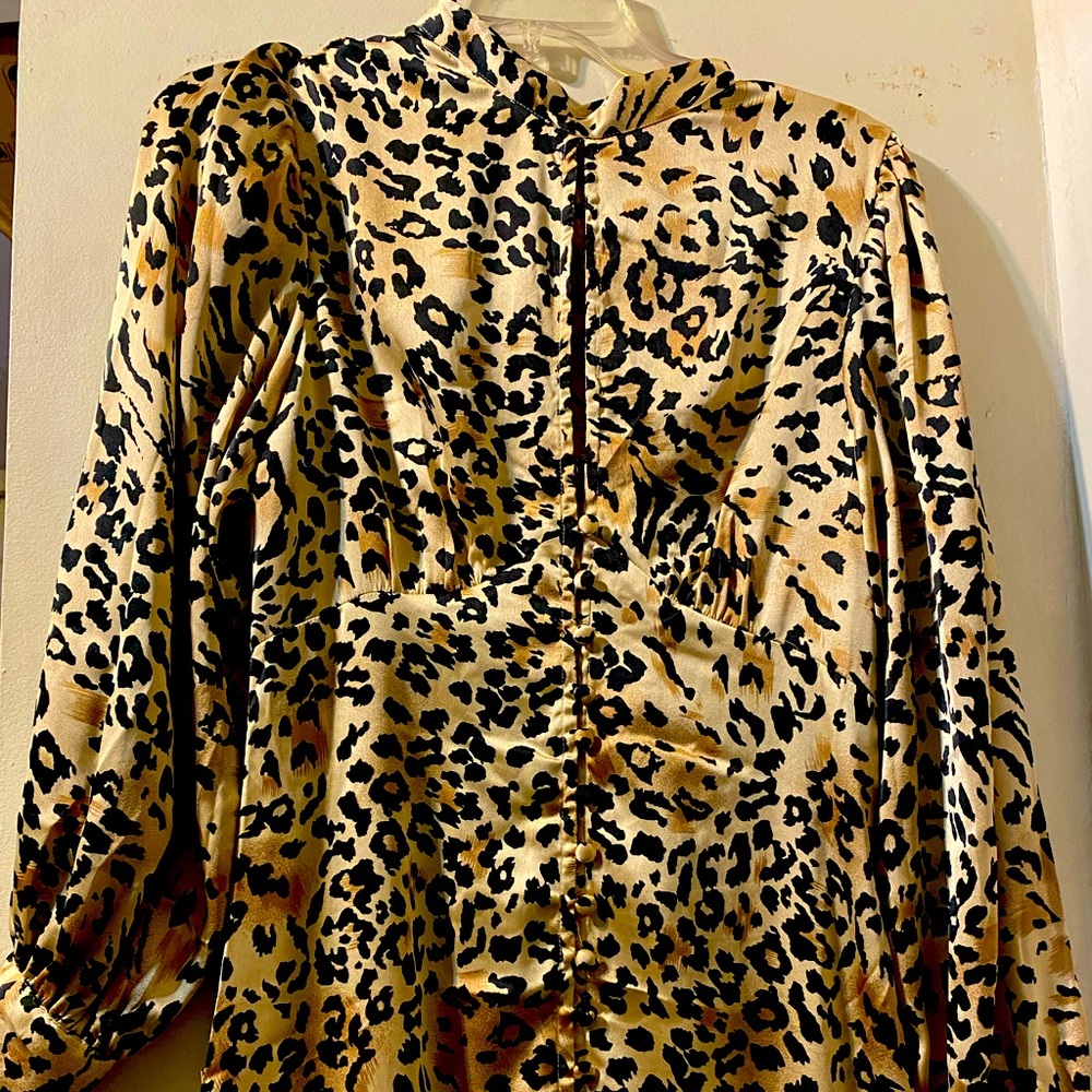 High neck keyhole detail button down front open back with tie long sleeves slit